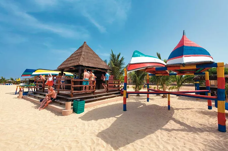 Pools and low-rise buildings of Hotel Riu Funana, a 5-star beachfront all inclusive resort at Santa Maria on Sal, Cape Verde
