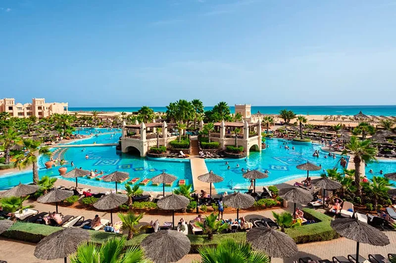 Low-rise buildings and pool terraces of Hotel Riu Touareg, an all inclusive resort on the Lacacão coast of Boa Vista, Cape Verde